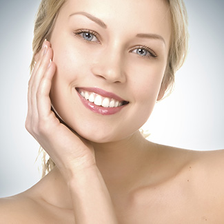 Woman smiling after getting BOTOX treatment